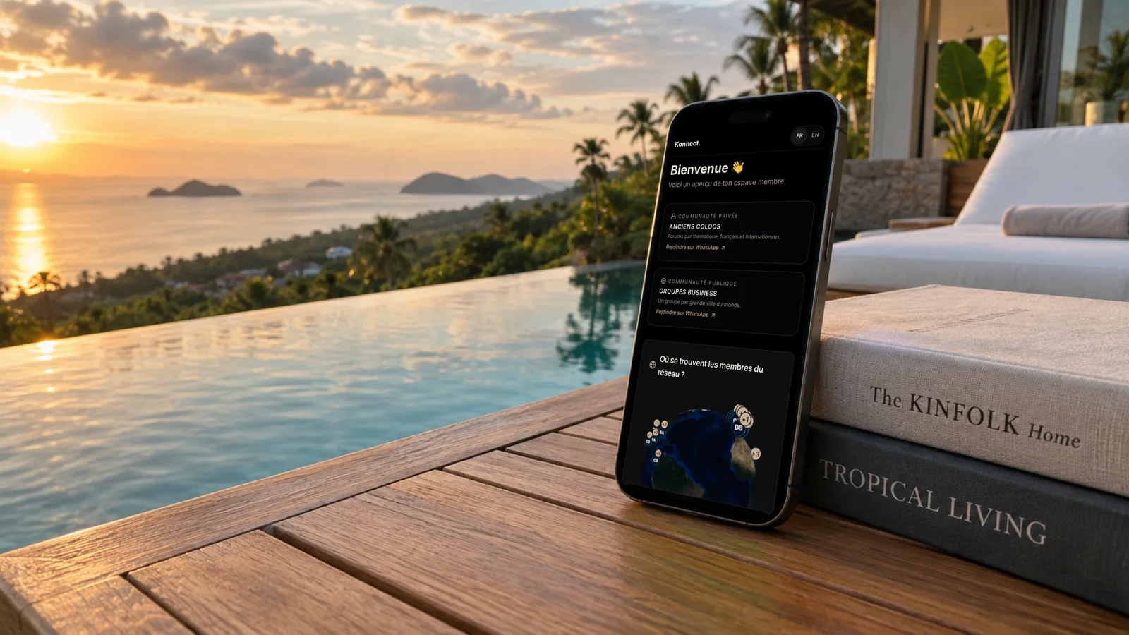 L'app membre Konnect sur un téléphone posé au bord d'une piscine à débordement à Koh Samui
